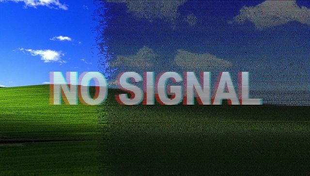 No signal glitch over green hill with rgb shift, pixelation, scanlines and broadcast corruption