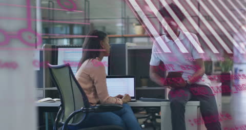 Diverse Colleagues Collaborating in Modern Office with Data Visualization