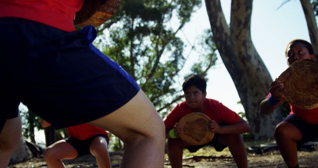 Kids Engaging in Outdoor Physical Training with Wooden Log Weights - Download Free Stock Images Pikwizard.com