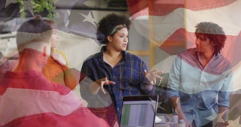 Diverse Business Team Discussing in Patriotic Office