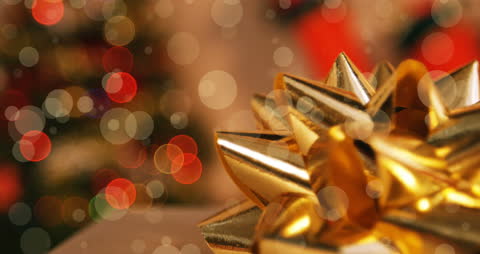 Golden Ribbon and Bokeh Lights Evoke Festive Warmth
