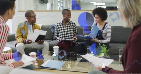 Team Collaborating with Technology at Office Meeting