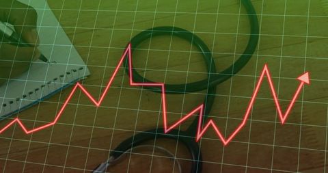 Stethoscope with red analytics trend line on wood background for medical data dashboard