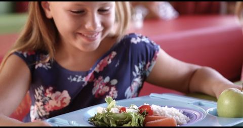 Smiling Girl Enjoying Healthy School Lunch