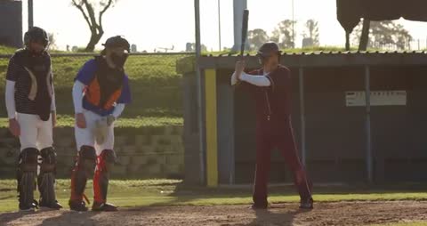 Baseball Player Focused at Bat with Catcher and Umpire