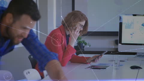 Business Professionals Using Technology in Office Environment