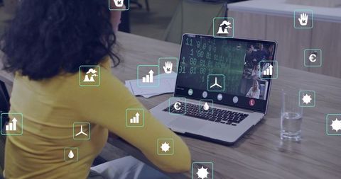 Woman joining remote video call at office desk with data analytics overlay and teamwork