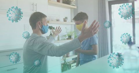 Father and Son Wearing Masks in Hygienic Kitchen Environment