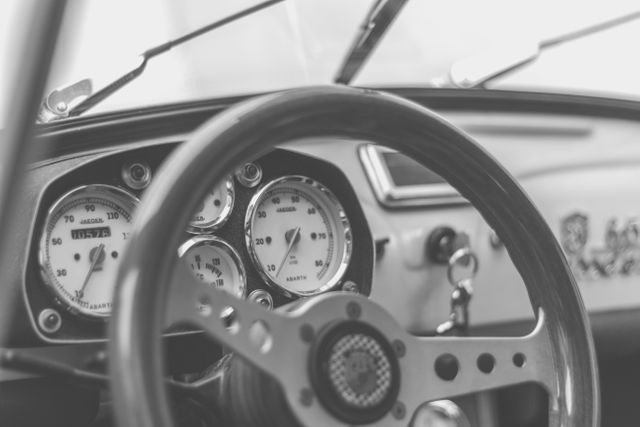 Close-up of Classic Car Steering Wheel and Dashboard in Black and White - Download Free Stock Photos Pikwizard.com