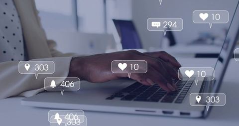 Typing hands on laptop with floating social media notifications for digital engagement