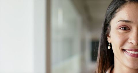 Confident Businesswoman Smiling in Corporate Office