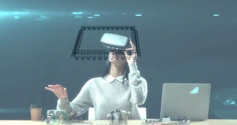 Woman experiencing virtual interface with vr headset