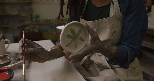 Potter Painting Ceramic Bowl in Studio - Download Free Stock Images Pikwizard.com