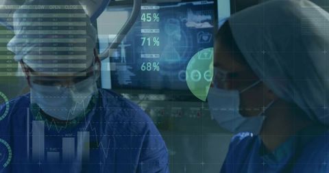 Surgeons consulting augmented data displays during high-tech operating room procedure