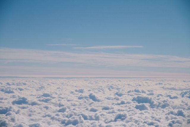Vast Cloudscape with Clear Blue Sky Captured from Above - Download Free Stock Photos Pikwizard.com