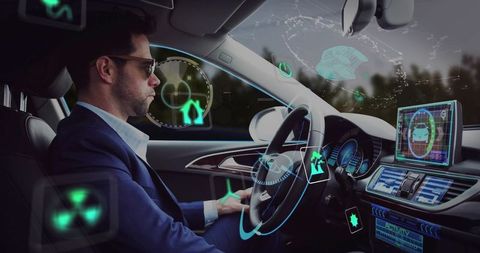 Professional man navigating car with advanced holographic interface