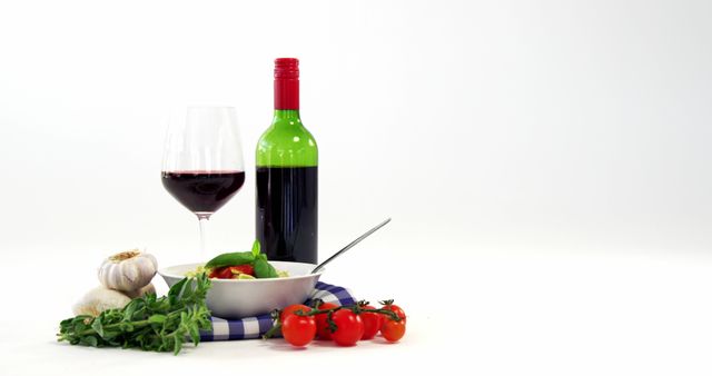 Italian Dinner Table with Red Wine, Pasta, and Fresh Vegetables - Download Free Stock Images Pikwizard.com