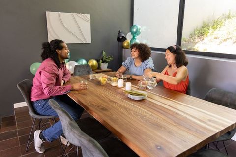 Diverse Friends Enjoying Casual Gathering at Modern Dining Table