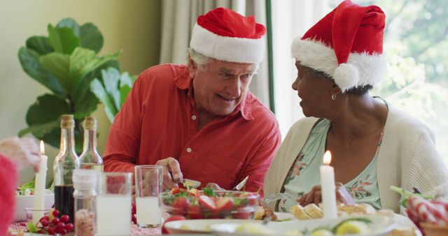 Elderly Couple Celebrating Christmas at Festive Dinner Table - Download Free Stock Images Pikwizard.com