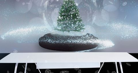 A decorative display of a Christmas tree enclosed in a snow globe, with snow falling and glowing particles adding a magical effect. This winter-themed, festive image is perfect for holiday season promotions, greeting cards, and decoration ideas.