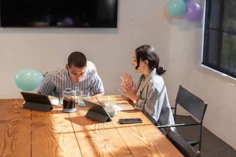 Diverse Business Colleagues Engaged in Digital Collaboration Meeting