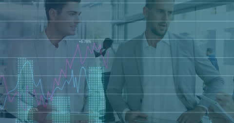 Business Team Analyzing Graphs with Digital Interface