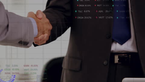 Businessmen in Formal Attire Shaking Hands with Financial Graphs Overlay