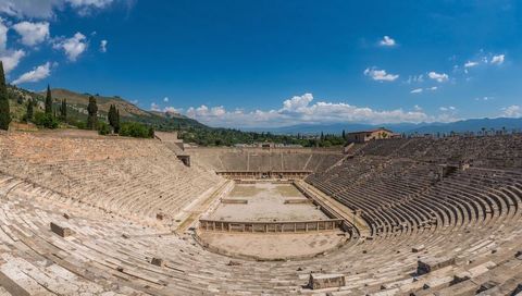 Ancient Roman Amphitheatre Basking in Sunlight on Hilltop Panoramic Interior View