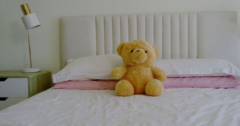 Cozy Bedroom with Teddy Bear and Minimalist Decor