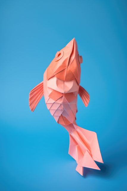 Close up of origami figure of fish on blue background, created using generative ai technology - Download Free Stock Photos Pikwizard.com