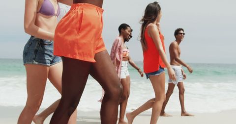 Diverse Friends Enjoying Sunny Day Beach Walk - Download Free Stock Images Pikwizard.com
