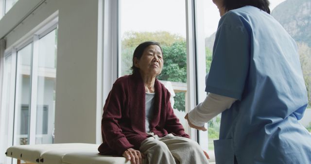 Elderly Woman Receiving Care from Nurse in Healthcare Facility - Download Free Stock Images Pikwizard.com