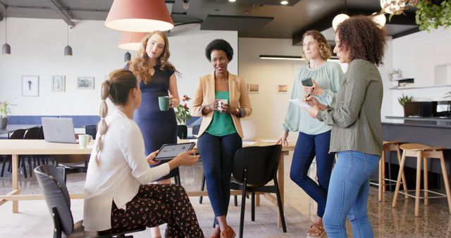 Diverse Group of Women Having Informal Meeting in Modern Office - Download Free Stock Images Pikwizard.com