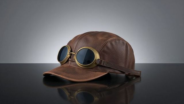 Retro brown leather aviator cap with brass goggles