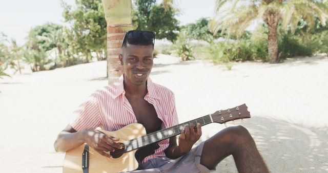 Man Playing Acoustic Guitar on Tropical Beach - Download Free Stock Images Pikwizard.com