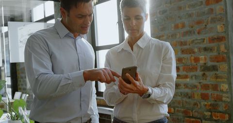 Business Professionals Collaborating Using Smartphone - Download Free Stock Images Pikwizard.com