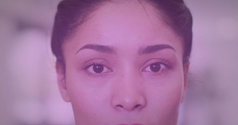 Close-up of Young Woman with Neutral Expression, Soft Background