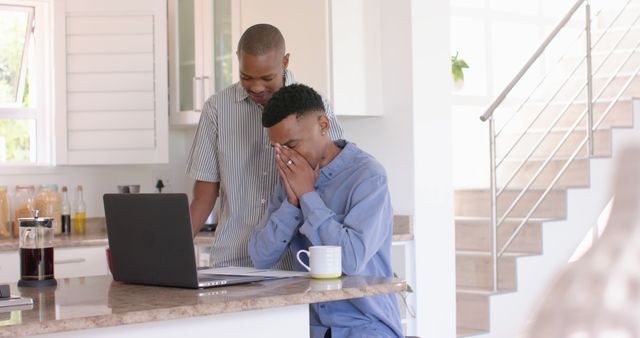 Worried Man Receiving Comfort from Friend in Modern Kitchen - Download Free Stock Images Pikwizard.com