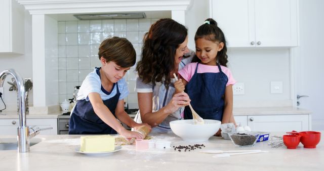 Mother and Children Baking Together in Home Kitchen - Download Free Stock Images Pikwizard.com