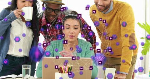 Collaborative Team Overseeing Digital Interface with Network Icons