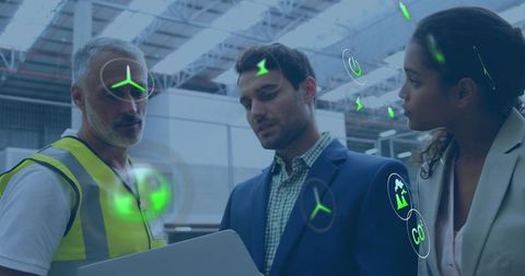 Logistics team reviewing ar analytics in warehouse for sustainability and operations