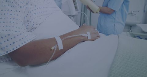 Patient Receiving IV Drip in Hospital Room