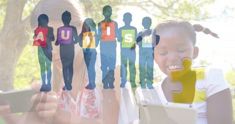 Autism Awareness Concept with Schoolgirls Using Tablets Outdoors