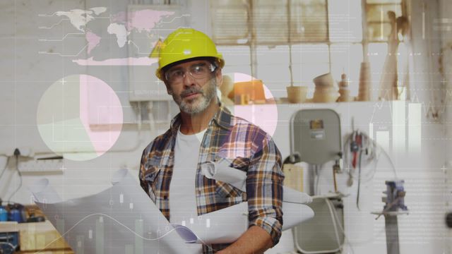 Architect wearing hardhat and glasses stands in modern office holding blueprints with digital data and statistics overlays around. Ideal for articles or advertisements about technological advancements in engineering and architecture, promotion of safety gear in industrial environments, or focusing on innovations in professional workspaces.