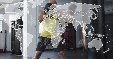 Boxer training in gym with world map overlay, digital fitness concept and boxing workout