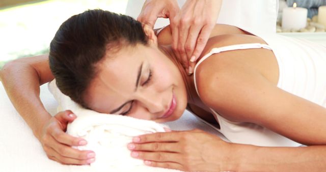 Woman receiving relaxing back and neck massage in spa - Download Free Stock Images Pikwizard.com