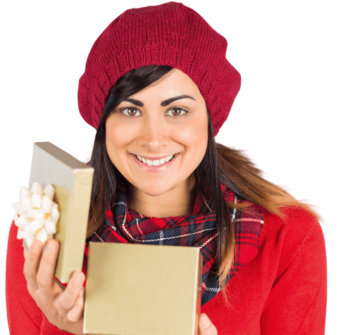Smiling woman in red hat opens transparent christmas gift box