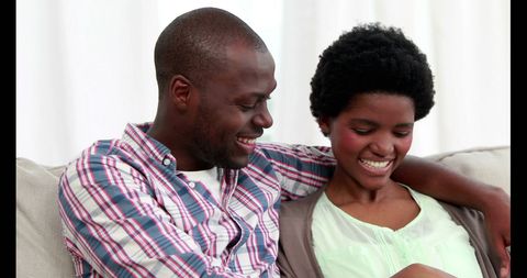 Couple on Couch Enjoying Relaxed and Happy Moment - Download Free Stock Images Pikwizard.com