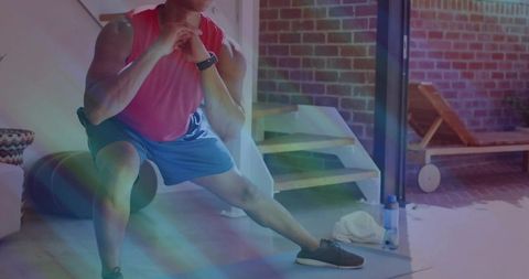 Athlete engaging in side lunge in home gym with fitness equipment