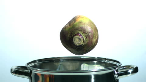 Slow Motion Turnip Dropping into Cooking Pot